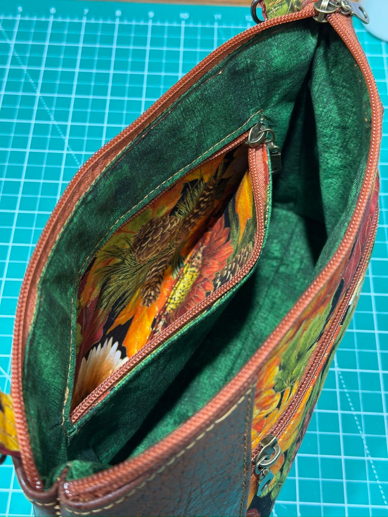 Additional product view of the TrailWorks floral print fabric crossbody bag with a zippered main compartment