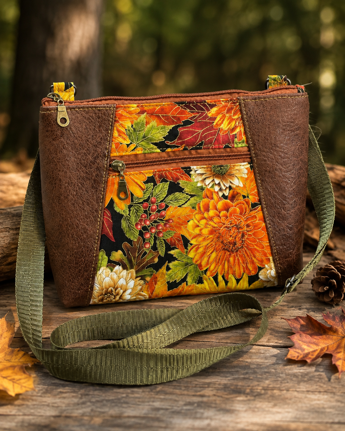 TrailWorks floral fabric crossbody bag in a lifestyle setting, with colorful flower print and an adjustable shoulder strap