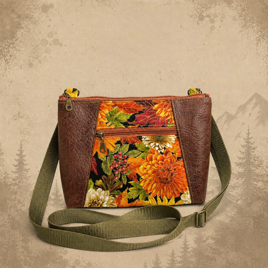 Handmade floral crossbody purse from TrailWorks Supply Co., showing its distinctive multicolor print and compact shape