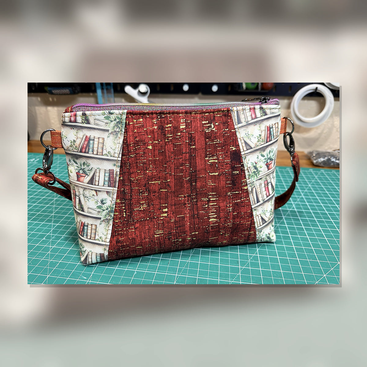 Back view of Book Nook Crossbody Bag with bookshelf print and burgundy center panel