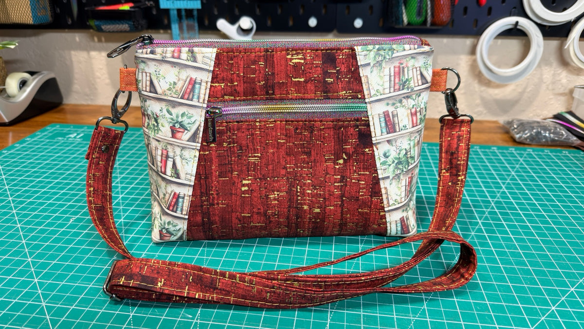 Book Nook Crossbody Bag with bookshelf print and burgundy accents